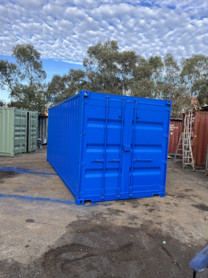 Shipping container newly painted, blue